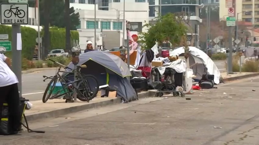 Tents set up by unhoused people.