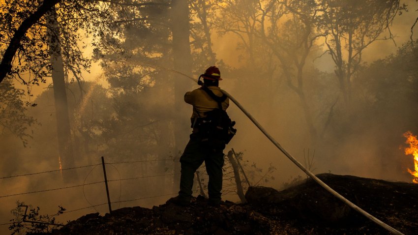 A private wild land firefighter monitors a backfire along Old Lawley Toll Road during the Glass Fire in Calistoga, California, U.S., October 2, 2020. Picture taken October 2, 2020.