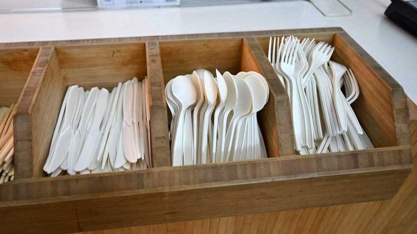 Single-use plastic cutlery is pictured in a tray at a fast-food outlet west of London on January 14, 2023. – England will ban a wide range of single-use plastic items from October including plates and cutlery in order to limit their "devastating" effect on the environment, the government said Saturday. (Photo by JUSTIN TALLIS / AFP) (Photo by JUSTIN TALLIS/AFP via Getty Images)