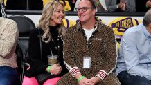 Jeanie Buss and Jay Mohr attend a playoff basketball game between the Los Angeles Lakers and the Golden State Warriors.