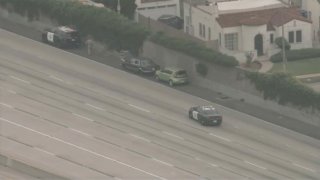 Part of the 110 Freeway was closed in the South Los Angeles area Monday May 15, 2023 due to a standoff after a pursuit.