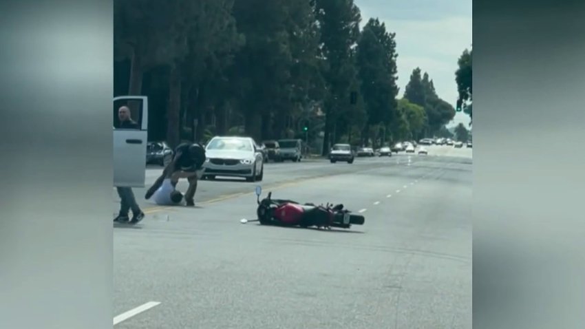 Traffic stopped on a Granada Hills street Tuesday June 14, 2023 when a fight broke out in the middle of the road.