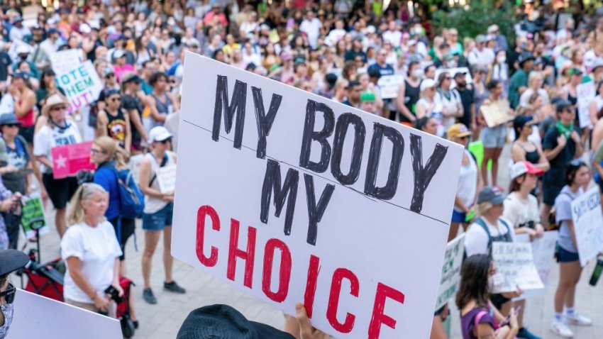 A person holds a sign “My Body My Choice” as abortion rights activists protest at the Federal Courthouse Plaza after the overturning of Roe Vs. Wade by the US Supreme Court, in Austin, Texas, on June 24, 2022. – The US Supreme Court on Friday struck down the right to abortion in a seismic ruling that shredded five decades of constitutional protections and prompted several right-leaning states to impose immediate bans on the procedure. (Photo by SUZANNE CORDEIRO / AFP) (Photo by SUZANNE CORDEIRO/AFP via Getty Images)