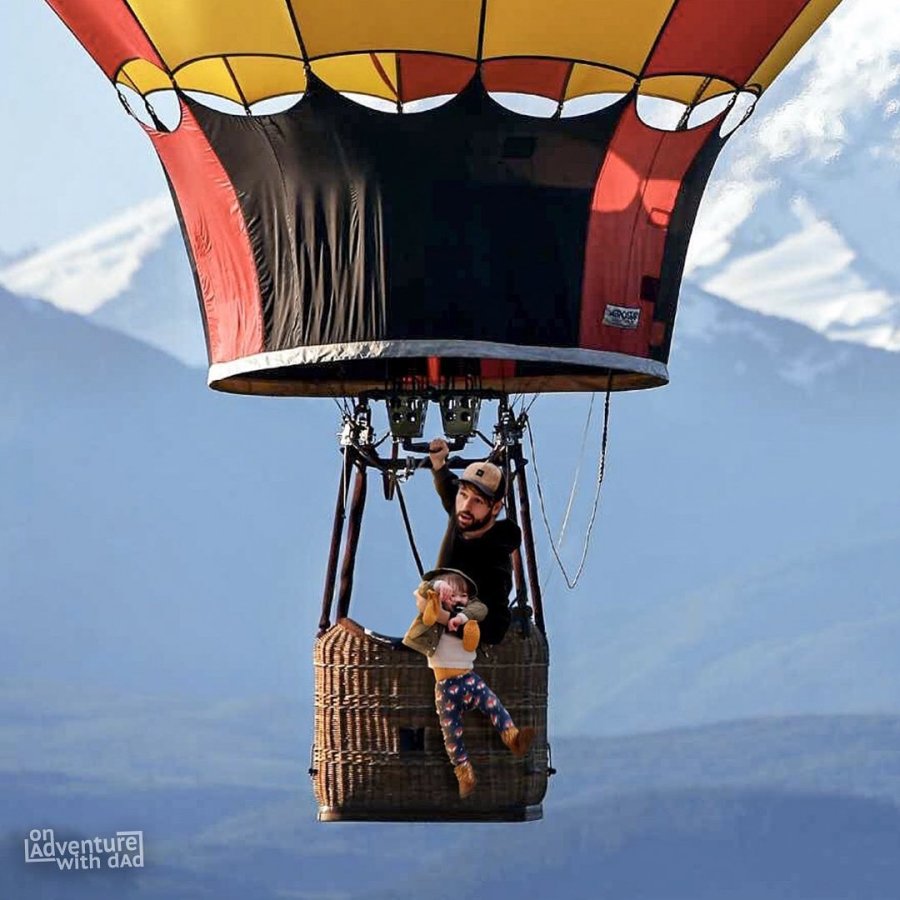 A photoshopped image of Kenny Deuss holding onto Alix over the side of a hot air balloon.