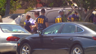 FBI and other federal agents conduct a search along White Oak Ave. in Reseda on Thursday, July 27, 2023.