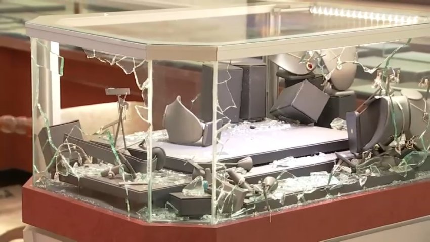 A smashed jewelry display case after a robbery at Jewels on Lake in Pasadena.