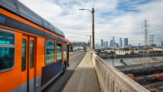 Bus moving across the 6th street bridge in LA.