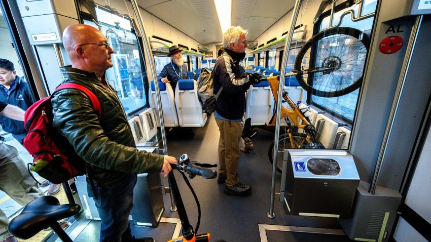 Redlands, CA – October 24: Passengers board the train along with their bikes on Monday, Oct. 24, 2022, as they ride the Arrow, the new 9-mile rail service between Redlands and San Bernardino. The train welcomed its first passengers more than three years after construction on the line began. (Photo by Watchara Phomicinda/MediaNews Group/The Press-Enterprise via Getty Images)