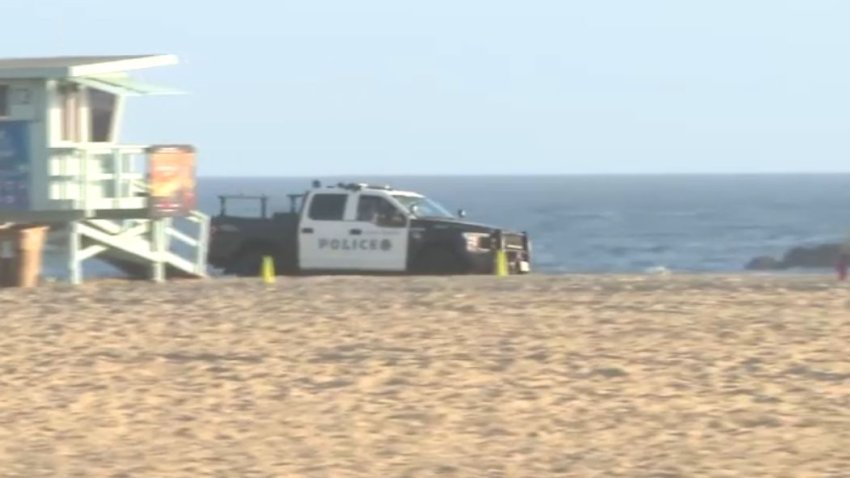 Police patrol a beach in Santa Monica in June 2024.