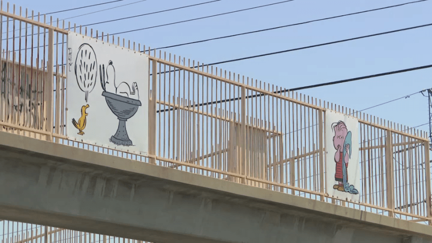 The bridge — which features characters from Charles Schulz’s iconic “Peanuts” cartoon — sits over Wilbur Ave, adjacent to Tarzana Elementary School.