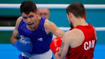 SANTIAGO, CHILE - OCTOBER 27: Wyatt Sanford (red) of Canada competes against Miguel Angel Martinez (blue) of Mexico during the Men's 63.5kg Finals at Centro de Entrenamiento Olimpico on Day 7 of Santiago 2023 Pan Am Games on October 27, 2023 in Santiago, Chile. (Photo by Jam Media/Getty Images)