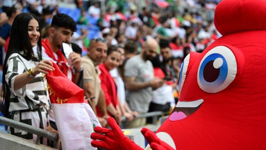 Olympic Phryge, the official mascot of the Paris 2024 Olympic Games greets supporters before the start of the men’s group B football match between Argentina and Iraq during the Paris 2024 Olympic Games at the Lyon Stadium in Lyon on July 27, 2024. (Photo by Olivier CHASSIGNOLE / AFP) (Photo by OLIVIER CHASSIGNOLE/AFP via Getty Images)