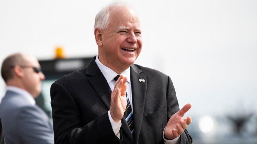 Minnesota Gov. Tim Walz, right, awaits the arrival of U.S. Vice President Kamala Harris at the Minneapolis-St. Paul International Airport in Saint Paul, Minnesota, March 14, 2024.