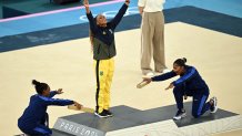 (LtoR) US' Simone Biles (silver), Brazil's Rebeca Andrade (gold) and US' Jordan Chiles (bronze) pose during the podium ceremony for the artistic gymnastics women's floor exercise event of the Paris 2024 Olympic Games at the Bercy Arena in Paris, on August 5, 2024. (Photo by Paul ELLIS / AFP) (Photo by PAUL ELLIS/AFP via Getty Images)