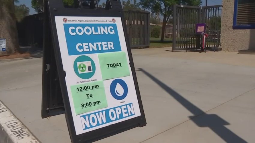 A cooling center sign is displayed in Los Angeles amid sweltering heat.