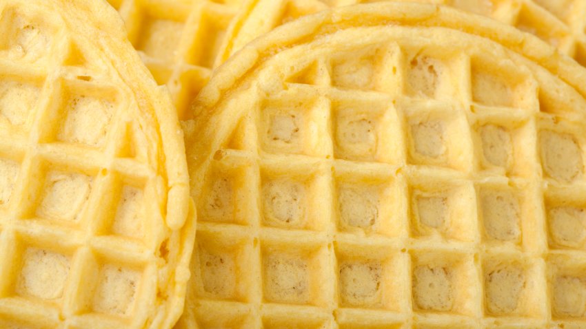 Frozen buttermilk waffles background; close up view