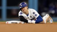 LOS ANGELES, CALIFORNIA – OCTOBER 26: Shohei Ohtani #17 of the Los Angeles Dodgers lies on the ground injured after attempting to steal second base as they play against the New York Yankees in the seventh inning during Game Two of the 2024 World Series at Dodger Stadium on October 26, 2024 in Los Angeles, California. (Photo by Harry How/Getty Images)