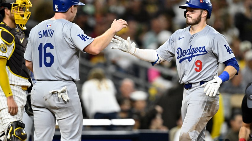 Oct 9, 2024; San Diego, California, USA; Los Angeles Dodgers second baseman Gavin Lux (9) celebrates with catcher Will Smith (16) after hitting a two-run home run in the seventh inning against the San Diego Padres during game four of the NLDS for the 2024 MLB Playoffs at Petco Park.  Mandatory Credit: Denis Poroy-Imagn Images