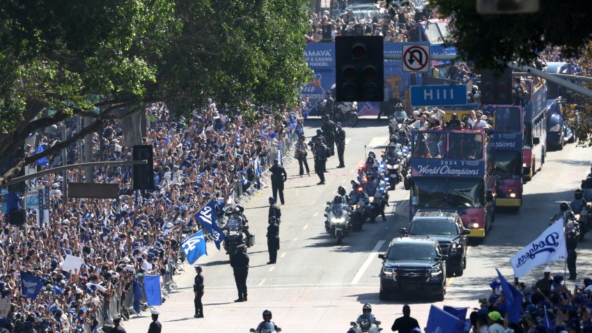 The Los Angeles Dodgers players, staff, families and friends celebrate with fans during the Dodgers 2024 World Series Championship parade in downtown Los Angeles.