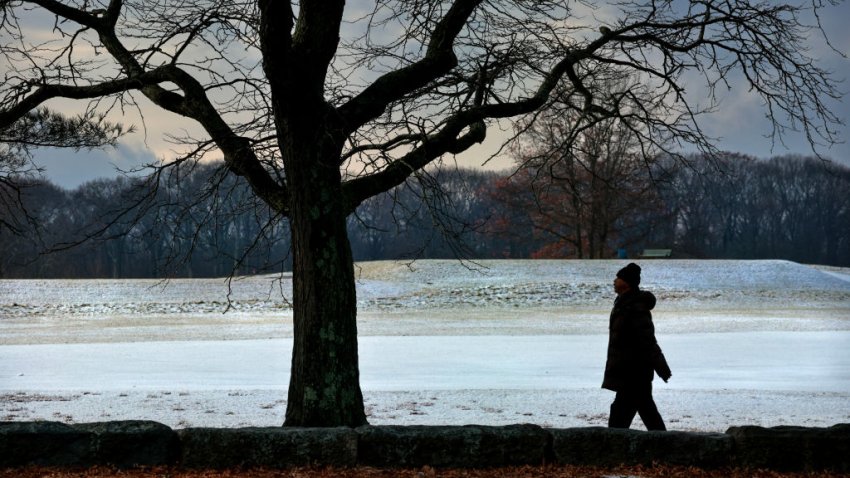 Boston, MA – December 5: A man passes the snow covered William J. Devine Golf Course at Franklin Park. (Photo by Craig F. Walker/The Boston Globe via Getty Images)