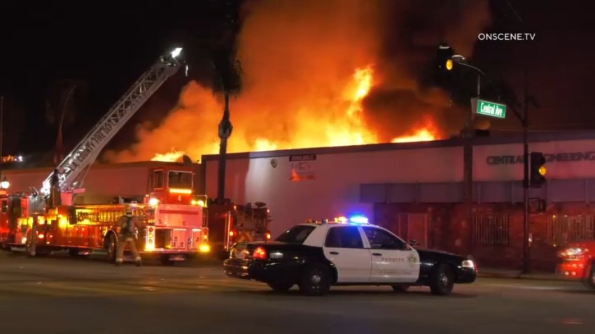 Firefighters respond to a blaze at an Amazon warehouse in south El Monte on Sunday, Dec. 8, 2024.