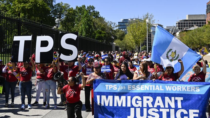 WASHINGTON, UNITED STATES – SEPTEMBER 15: A group of people, demanding Temporary Protected Status (TPS) for essential workers, march in solidarity with immigrant workers and their families in front of The White House in Washington, DC, United States on September 15, 2023. (Photo by Celal Gunes/Anadolu Agency via Getty Images)