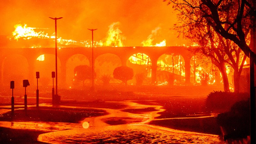 The Pasadena Jewish Temple & Center burns during the Eaton fire in Pasadena, California on January 7, 2025. A ferocious wildfire in a Los Angeles suburb devoured buildings and sparked panicked evacuations January 7, as hurricane-force winds tore through the region. More than 200 acres (80 hectares) was burning in Pacific Palisades, a upscale spot with multi-million dollar homes in the Santa Monica Mountains.