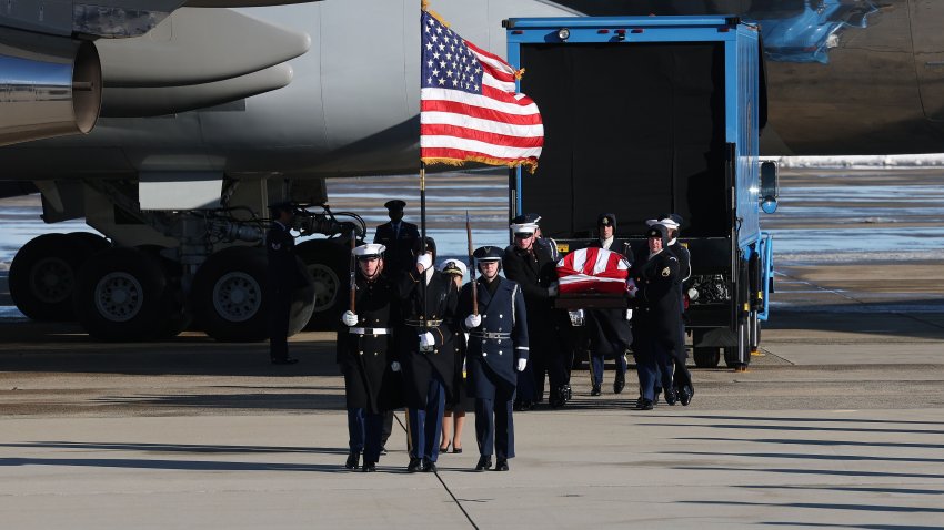 JOINT BASE ANDREWS, MARYLAND – JANUARY 07: A military honor cordon transfers the flag-draped casket of former U.S. President Jimmy Carter to a hearse during an arrival ceremony on January 07, 2025 in Joint Base Andrews, Maryland. Carter‚Äôs body will lie in state in the Capitol Rotunda until a funeral service at the National Cathedral in Washington on January 9. Carter, the 39th President of the United States, died at the age of 100 on December 29, 2024 at his home in Plains, Georgia. (Photo by Kevin Dietsch/Getty Images)