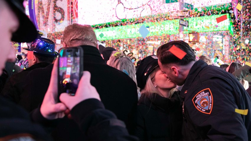 NEW YORK, NY – JANUARY 01: A couple kiss as confetti falls over Times Square to celebrate the New Year of 2025 on January 1, 2025 in New York City. (Photo by Liao Pan/China News Service/VCG via Getty Images)