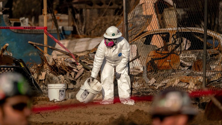 Workers with the US Army Corps of Engineers remove debris from a home destroyed by the Eaton Fire in Altadena, California, US, on Tuesday, Feb. 11, 2025. The Federal Emergency Management Agency (FEMA) and the US Army Corps of Engineers (USACE) began removing fire debris on Tuesday from private properties damaged or destroyed by the January wildfires. Photographer: Kyle Grillot/Bloomberg via Getty Images