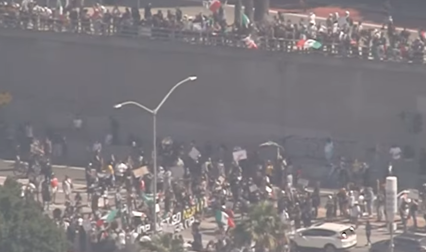 A crowd enters the 101 Freeway during protests on Sunday, June 8, 2025 in downtown LA.