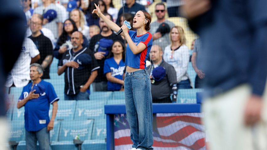 LOS ANGELES, CALIFORNIA – JUNE 14: Nezza sings the national anthem in Spanish before a baseball game between the Los Angeles Dodgers and San Francisco Giants at Dodger Stadium on June 14, 2025 in Los Angeles, California. (Photo by Kevork Djansezian/Getty Images)