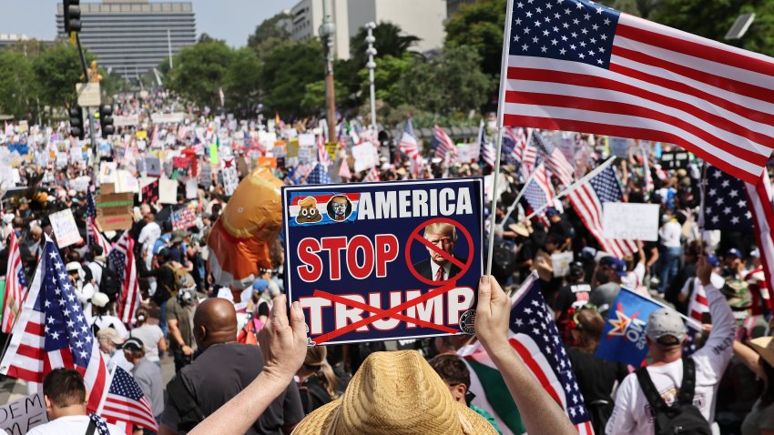 LOS ANGELES, CALIFORNIA – JUNE 14: Protesters rally in downtown Los Angeles during an anti-Trump “No Kings Day” demonstration in a city that has been the focus of protests against Trump’s immigration raids on June 14, 2025 in Los Angeles, California. Hundreds of marches and protests against the Trump istration and its policies are happening across the United States today. Protesters are also reacting in opposition to a planned military parade celebrating the 250th anniversary of the U.S. Army that is taking place in Washington, DC and which coincides with President Trump’s birthday.  (Photo by Mario Tama/Getty Images)