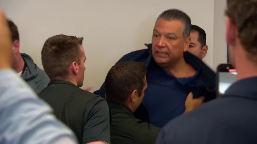 Sen. Alex Padilla is removed from a news conference with Homeland Security Secretary Noem Thursday June 12, 2025 in Los Angeles.