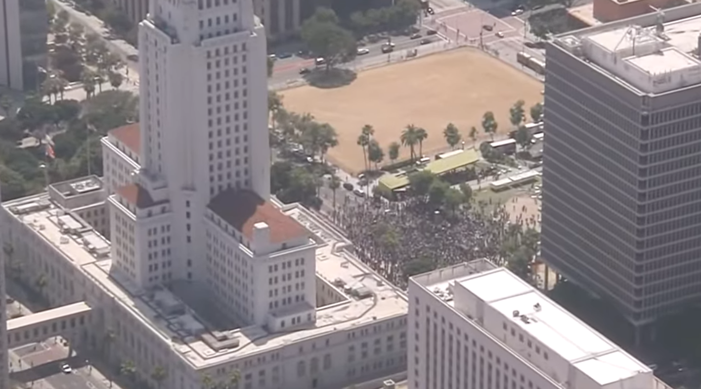 Protesters are pictured outside LA City Hall Sunday June 8, 2025.