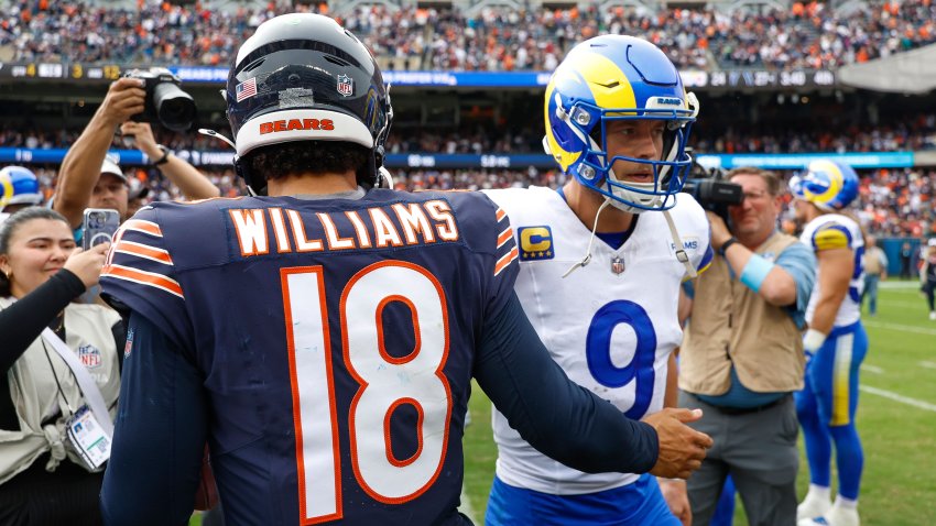 CHICAGO, ILLINOIS – SEPTEMBER 29: Caleb Williams #18 of the Chicago Bears greets Matthew Stafford #9 of the Los Angeles Rams following a game at Soldier Field on September 29, 2024 in Chicago, Illinois. (Photo by Brandon Sloter/Getty Images)