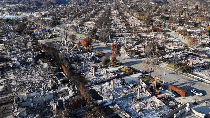 An aerial view shows homes destroyed in the Palisades Fire on January 27, 2025 in Pacific Palisades.
