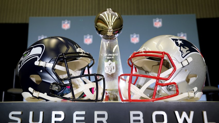 SAN JOSE, CALIFORNIA – FEBRUARY 02: The Vince Lombardi Trophy is framed by the Seattle Seahawks and New England Patriots helmets during Super Bowl LX Opening Night at San Jose McEnery Convention Center on February 02, 2026 in San Jose, California. (Photo by Chris Graythen/Getty Images)