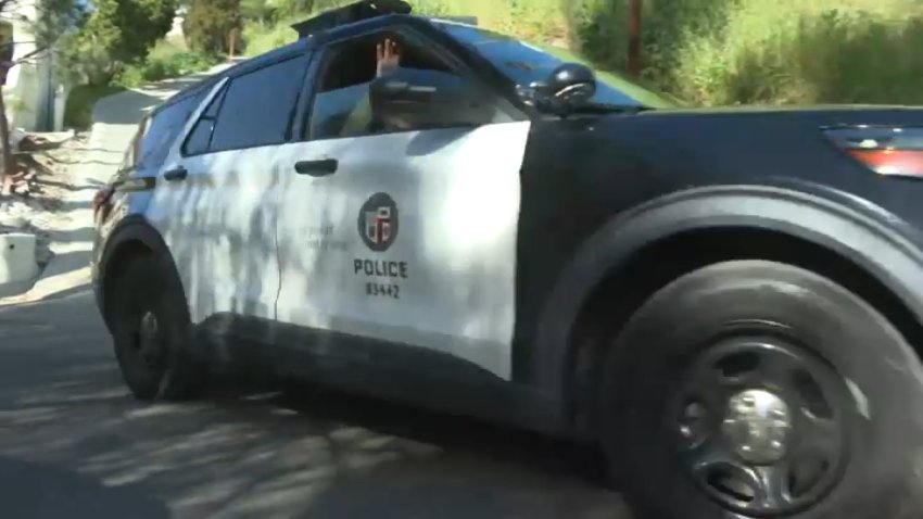 An LAPD cruiser patrols a Woodland Hills neighborhood on Sunday, Feb. 1, 2026.