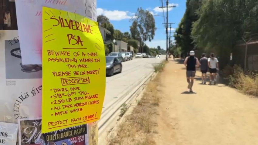 A sign posted at the Silver Lake Reservoir warns of a man who groped at least three women at the popular spot, as seen on Wednesday, April 22, 2026.