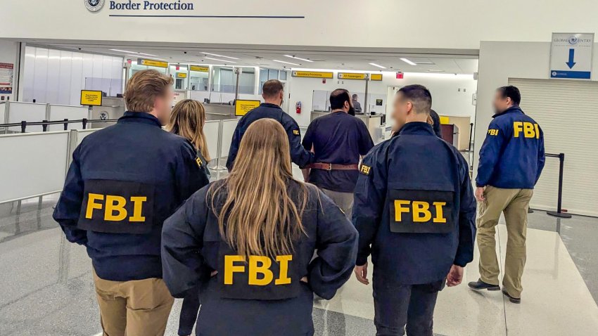Mohammad Al-Saadi surrounded by FBI agents during his arrest.