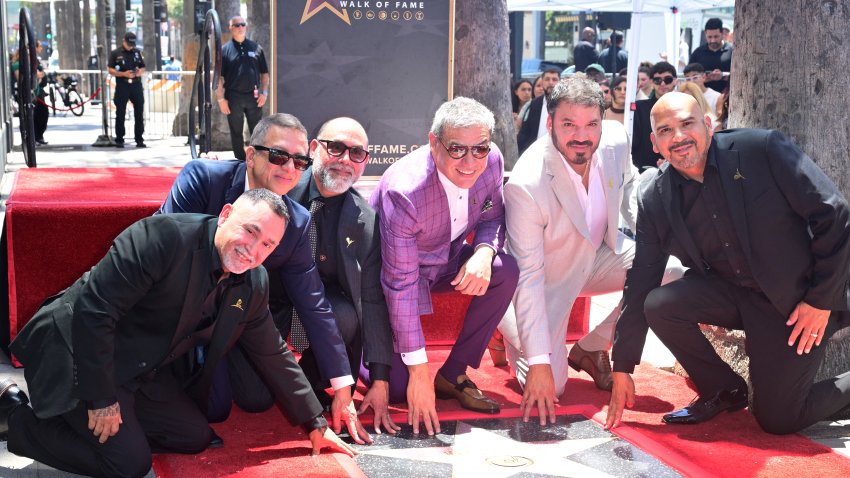 Members of Intocable (L/R) Sergio Serna, Alejandro Gulmar, Johnny Lee Rosas, Ricardo Munoz, Rene Martinez and Feliz Salinas pose on their newly unveiled Hollywood Walk of Fame star during a ceremony in Hollywood, California, on July 16, 2026. (Photo by Frederic J. BROWN / AFP via Getty Images)