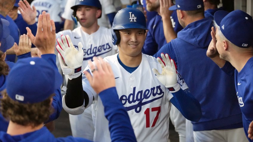 Jul 6, 2026; Los Angeles, California, USA; Los Angeles Dodgers designated hitter Shohei Ohtani (17) celebrates with teammates after hitting a two-run home run in the third inning against the Colorado Rockies at Dodger Stadium. Mandatory Credit: Kirby Lee-Imagn Images