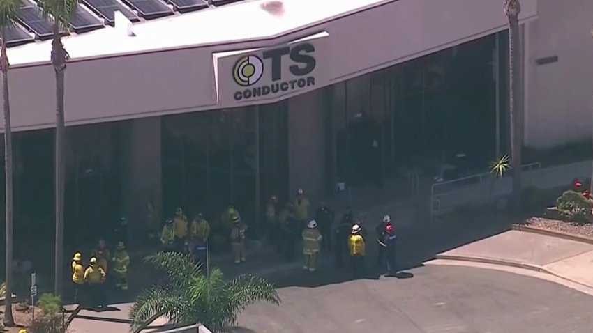 A hazardous materials team responded to what appeared to be a chemical mix-up that caused a reaction Wednesday morning at a business in Huntington Beach.
