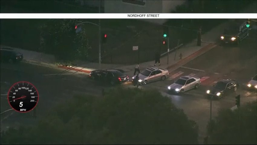 The moment four people jumped out of a car involved in a reckless driving pursuit on Sunday, July 26, 2026.