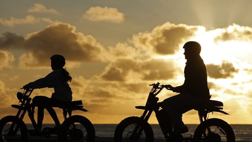 SAN DIEGO, CALIFORNIA – DECEMBER 27: Teenagers ride electric motorcycles along the La Jolla coastline at sunset on December 27, 2025 in San Diego, CA. (Photo by Kevin Carter/Getty Images)