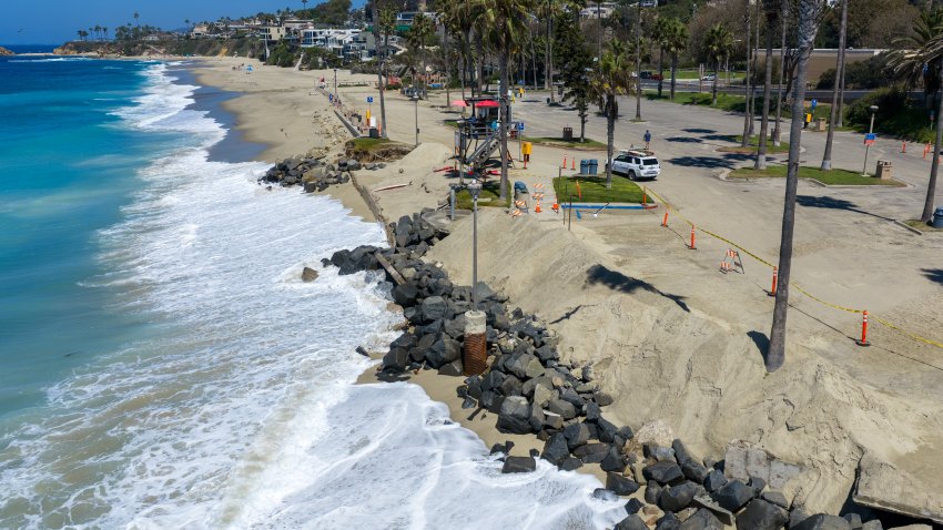 Laguna Beach, CA – Sept. 1, 2026: An aerial view of the incoming tide and swell at Aliso Beach in Laguna Beach, where recent storm surges caused damage to the parking lot area and erosion, on Tuesday, Sept. 1, 2026.  Officials have Labor Day weekend concerns about possible flooding in Southern California from the remnants of a storm off the coast of Baja. (Allen J. Schaben / Los Angeles Times via Getty Images)